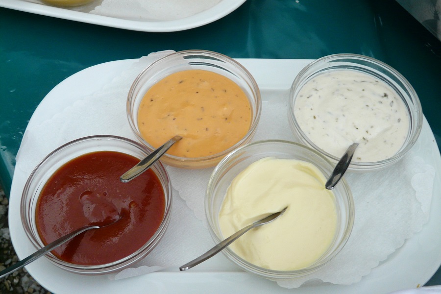 Whole30 Friendly Sauces and Dips Overhead View of Small Dishes Filled with Sauces and a Spoon Sticking Out of Each One