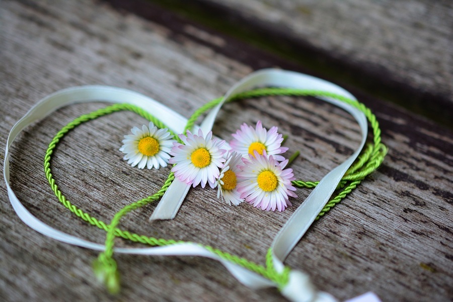 DIY Valentines Day Crafts for Kids Two Ribbons, One Green One White, Heart Shaped with Small Flowers in the Center
