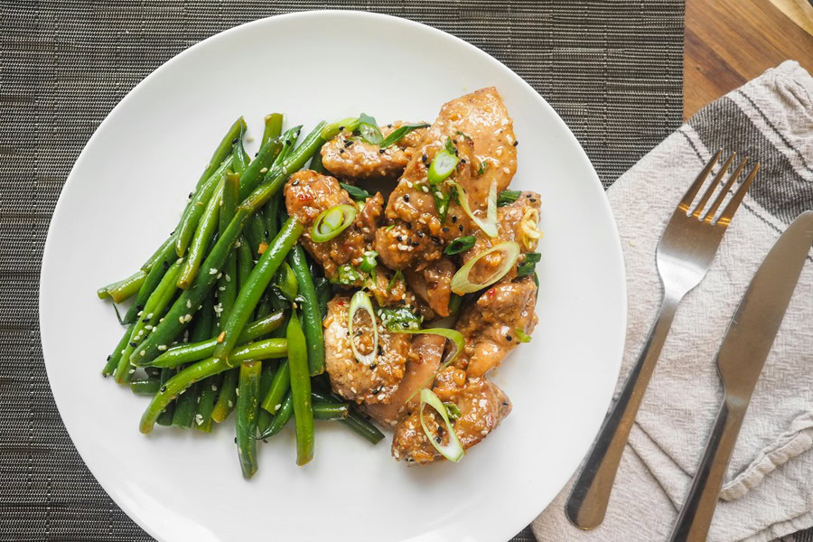 Best Quick Dinner Recipes Close Up of a Plate with Sweet and Sour Chicken and Green Beans