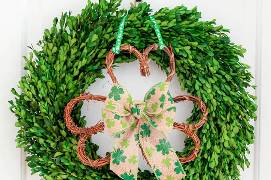 Creative St Patricks Day Decorations on a Budget Close Up of a Wreath Made of Plants with a Giant Shamrock Made of Branches in the Center