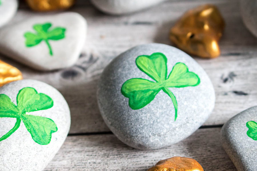 Creative St Patricks Day Decorations on a Budget Assorted River Rocks Some Painted Golden and Others with Small Shamrocks Painted On Them