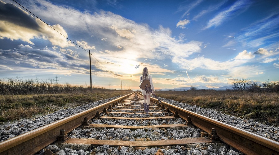 Deep Short Quotes about Life Woman with a Guitar Walking Down Railroad Tracks