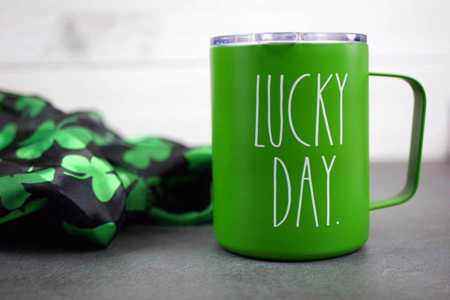 Green Cocktails for St. Patrick's Day Close Up View of a Green Mug That Says "Lucky Day" on It