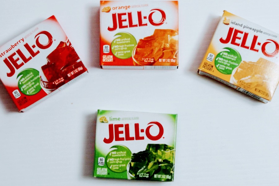 How Long Does it Take Jello Shots to Set Four Different Flavors of Jell-O Boxes on a White Surface