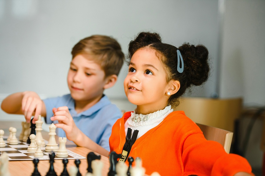 Motivational Quotes for Kids Two Young Children Sitting at Chessboards