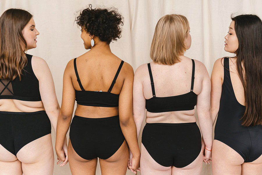 Body Quotes for Instagram About Positivity a Group of Women in Black Underwear Standing Next to Each Other with Their Backs Turned to the Camera