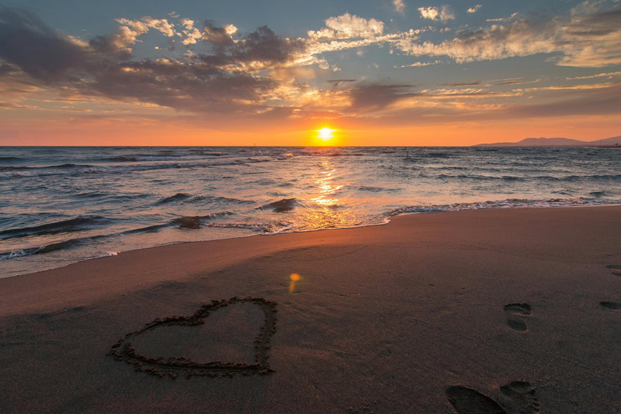 Best Places to Watch the Sunset in San Diego a Sunset Over an Ocean with a Heart Drawn into Sand