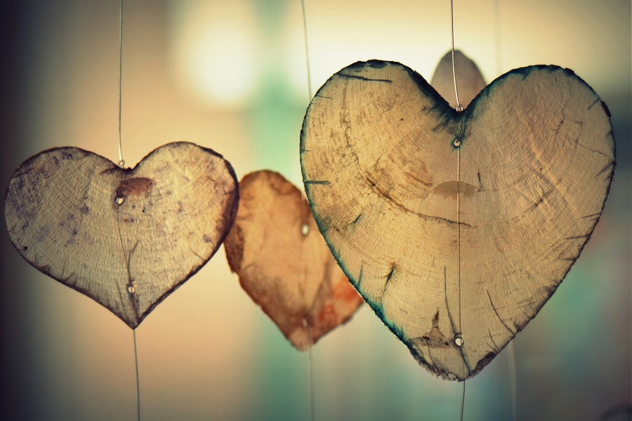 Quotes for People Who Lost a Loved One Close Up of a Wind Chime with Wooden Hearts