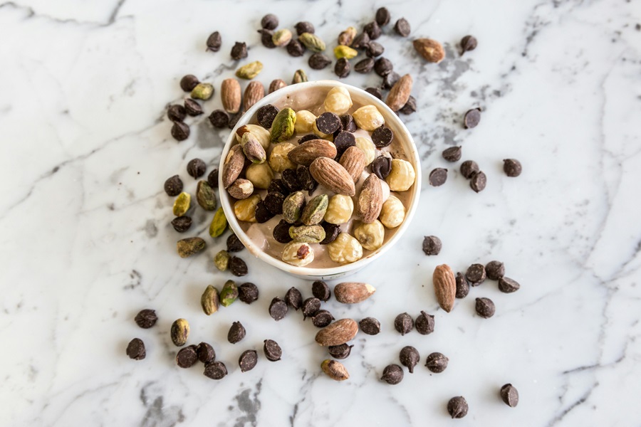 Best Snacks for Weight Loss to Carry with You a Small Bowl of Nuts and Chocolate Chips