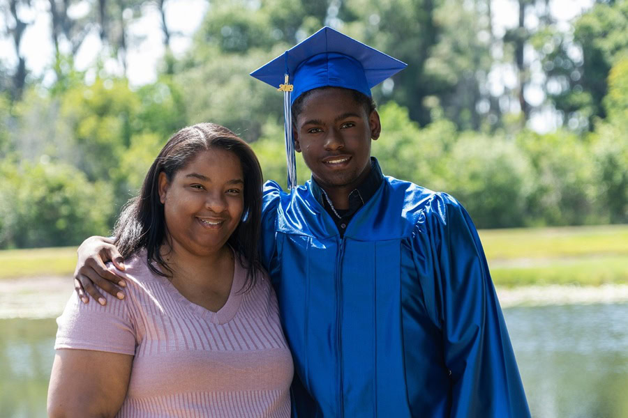 High School Graduation Party Foods a Mom and Her Teen Graduate Posing Together in Front of a Small Lake