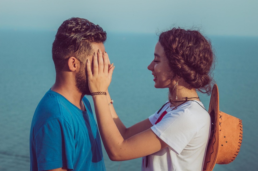 Funny Smartass Quotes About Relationships Woman Standing in Front of a Man with Her Hands Holding His Face