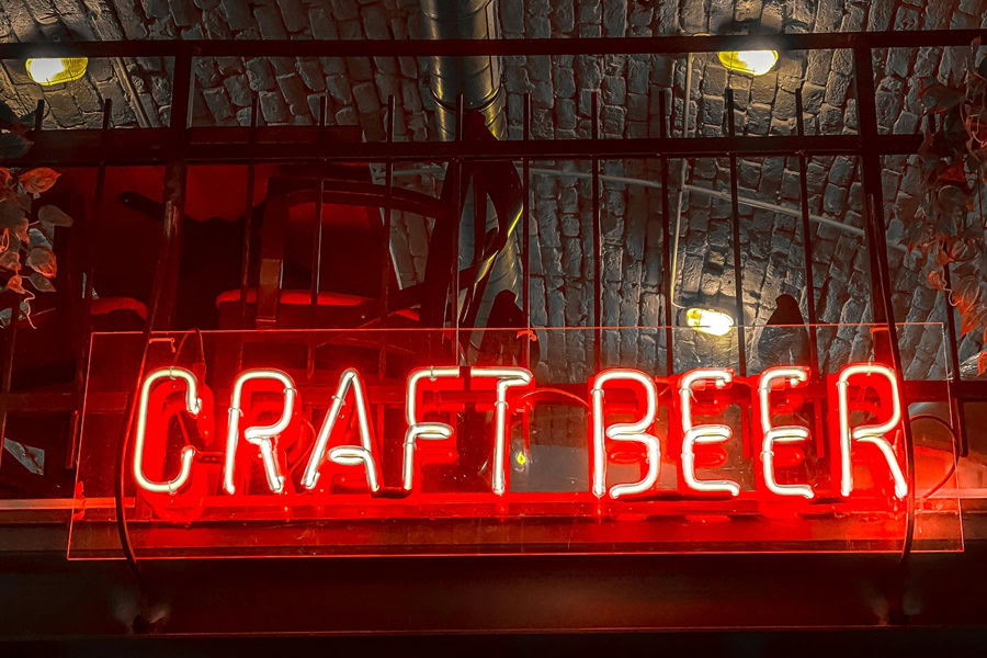 Best Craft Beer and Food Pairing Tips an LED 'Craft Beer' sign Lit Red