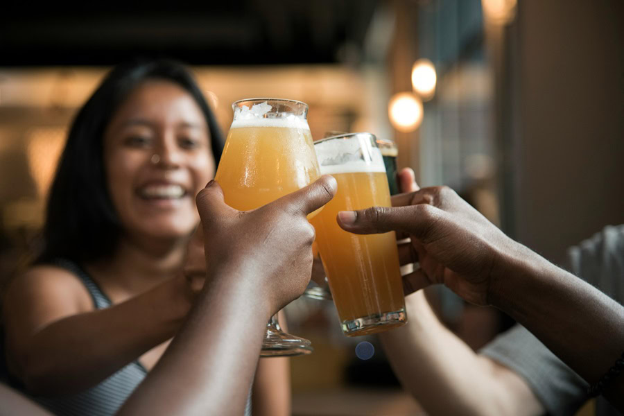 Best Craft Beer and Food Pairing Tips a Group of Friends Toasting with Beer