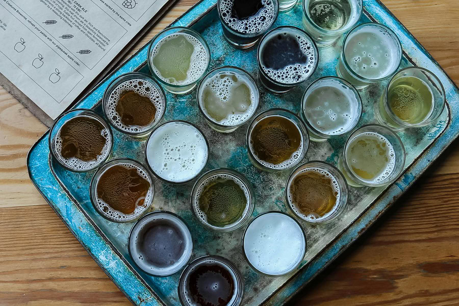 Best Craft Beer and Food Pairing Tips a Serving Tray Filled with Glasses of Beer