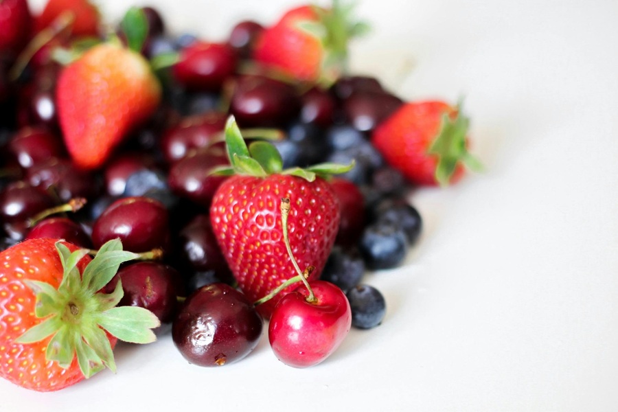 Clean Eating Tips for Beginners Mixed Berries on a White Surface