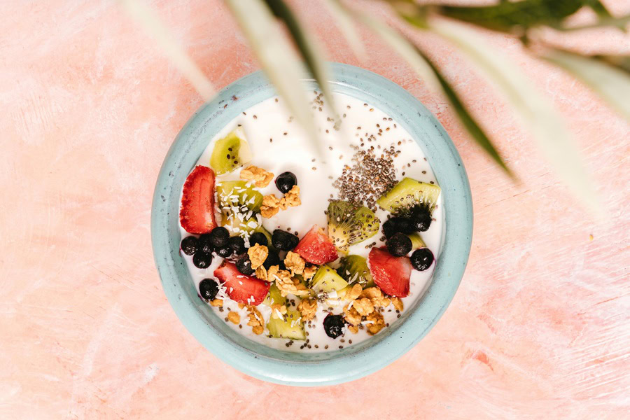 Clean Eating Tips for Beginners Overhead View of a Bowl of Yogurt Fruit and Oats