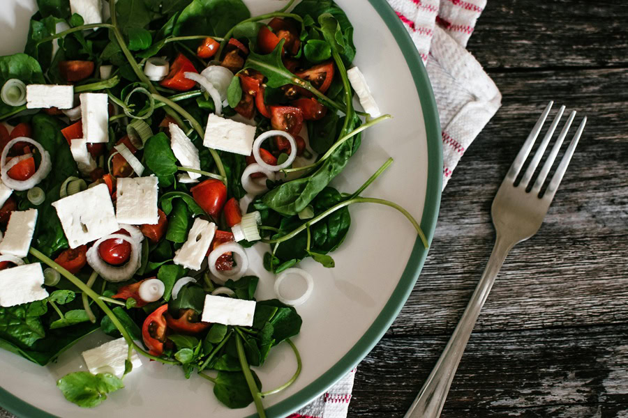 Clean Eating Tips for Beginners a Salad in a White Bowl with a Green Rim