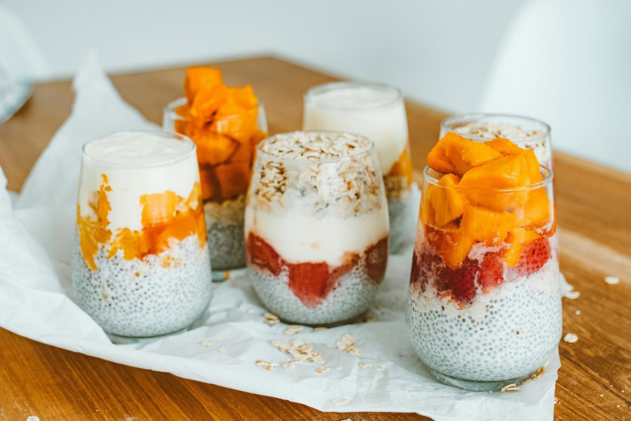 Clean Eating Tips for Beginners Cups of Yogurt with Fruit On Top