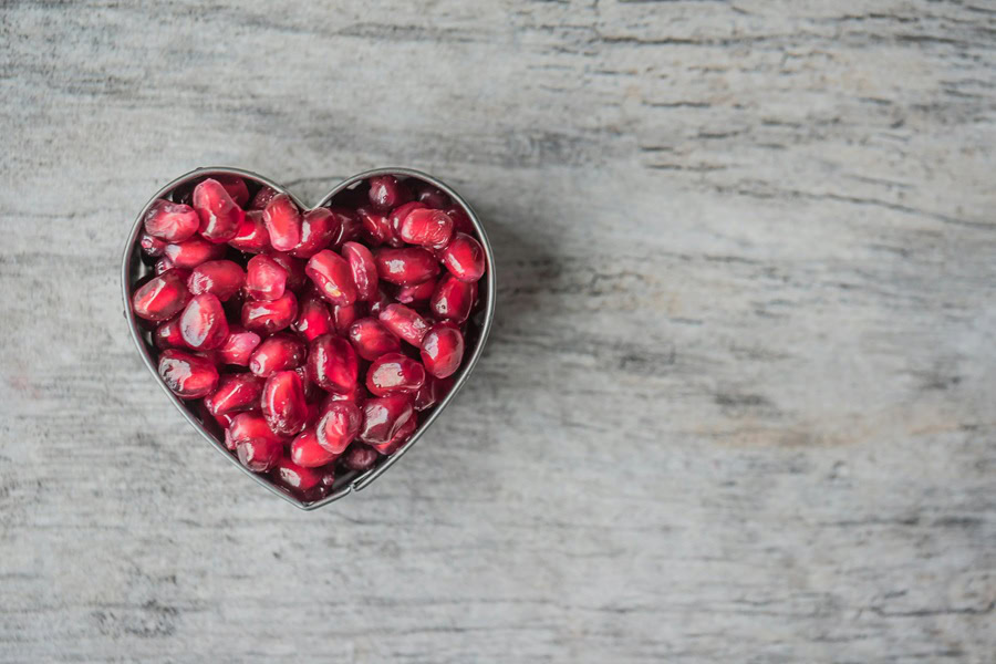 Clean Eating Tips for Beginners a Heart-Shaped Bowl of Pomegranate