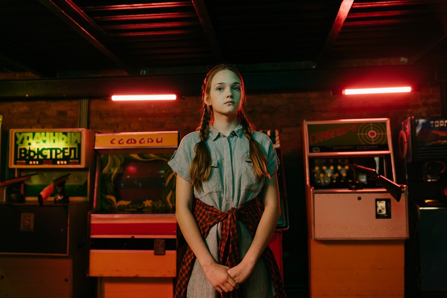 Stranger Things Memes Season 2 Young Girl Standing in a Dimly Lit Arcade with Red Lights