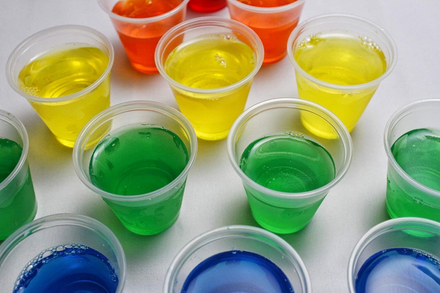 Tequila Jello Shot Recipes Close Up of Jello Shots in Blue, Green, Yellow, and Orange