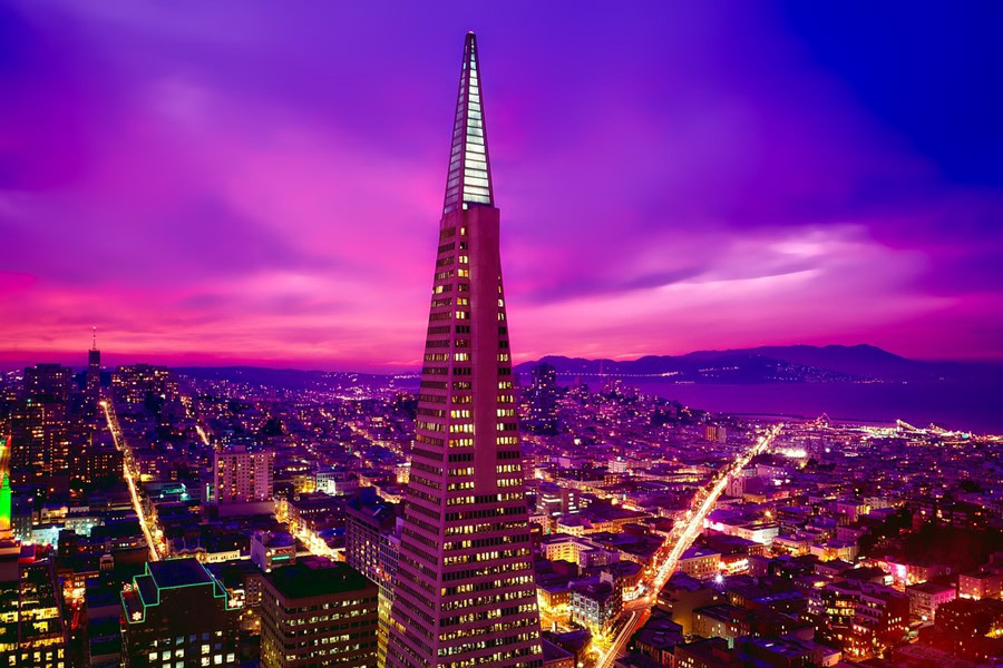 7 Things to See in San Francisco at Night a View of the Transamerica Building at Dusk with a Purple Red Sky Behind