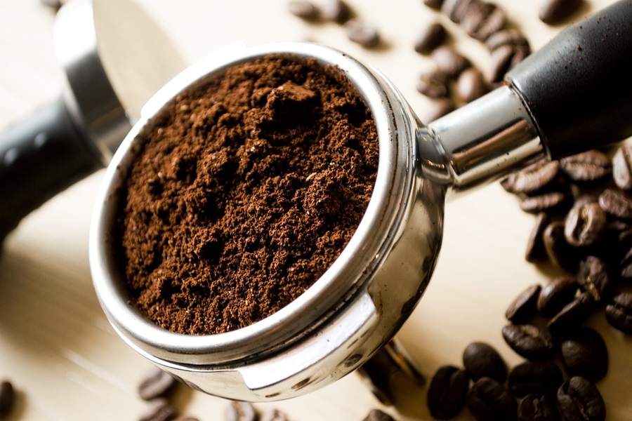 Coffee Quotes to Start Your Day #InternationalCoffeeDay Close Up of Ground Coffee beans in an Espresso Press
