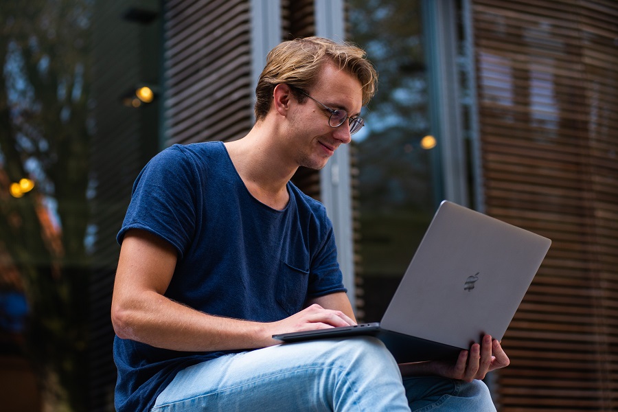 Dorm Room Decor Male Student Working on His Laptop Outside