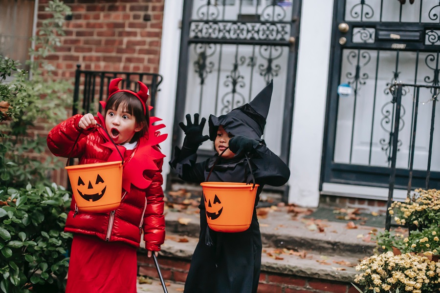 Halloween Games for Kids Two Little Kids Trick or Treating One Dressed as a Witch and the Other Dressed as a Devil