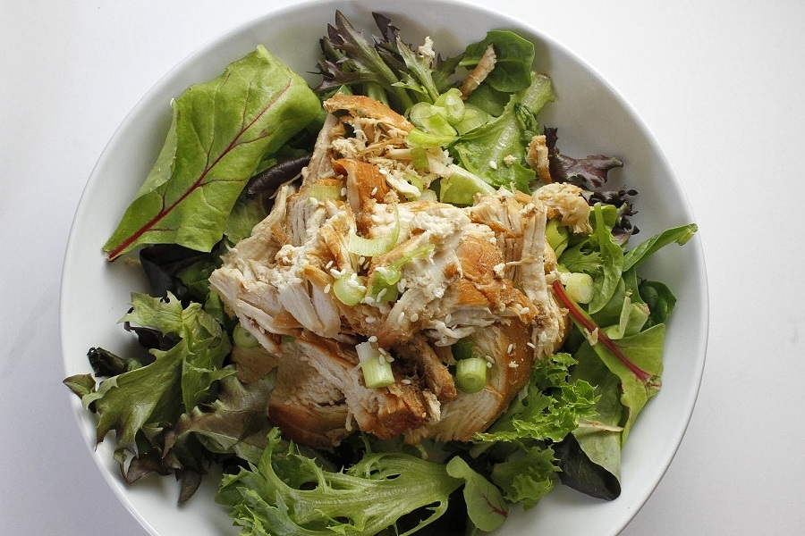 Easy Fall Dinner Party Recipes Close Up of a Bowl of Teriyaki Chicken on a Salad