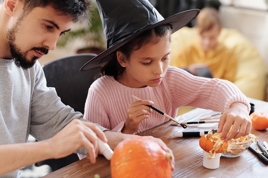 Halloween Letter Board Quotes Man and a Little Girl Painting Pumpkins