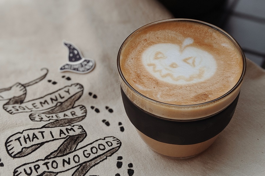 Halloween Letter Board Quotes Close Up of a Cup of Coffee with a Pumpkin in the Foam 