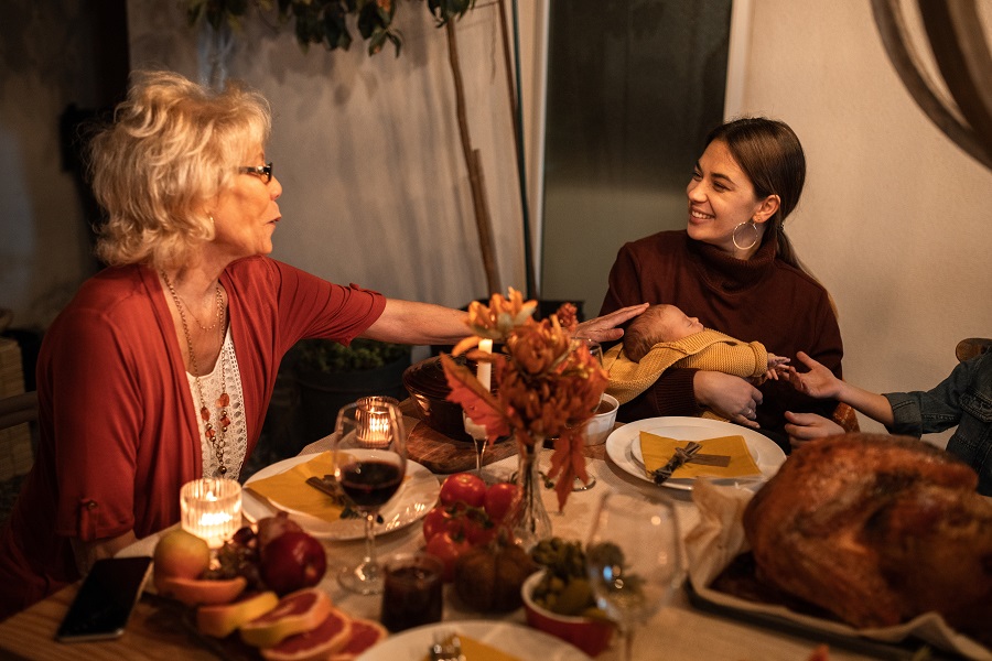 Air Fryer Thanksgiving Sides a Family at a Table Enjoying Thanksgiving Conversations Around Food