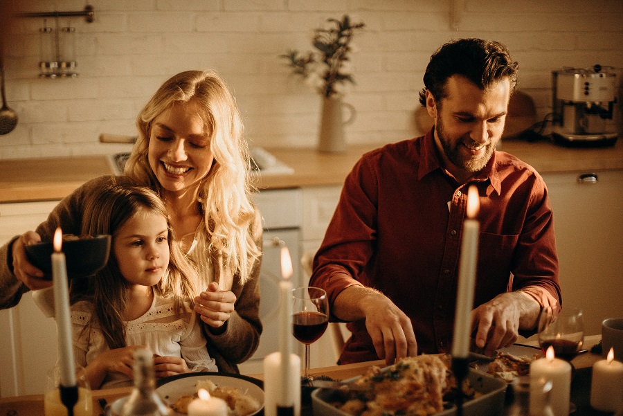 Air Fryer Thanksgiving Sides Family Sitting Down at a Table for Thanksgiving Dinner