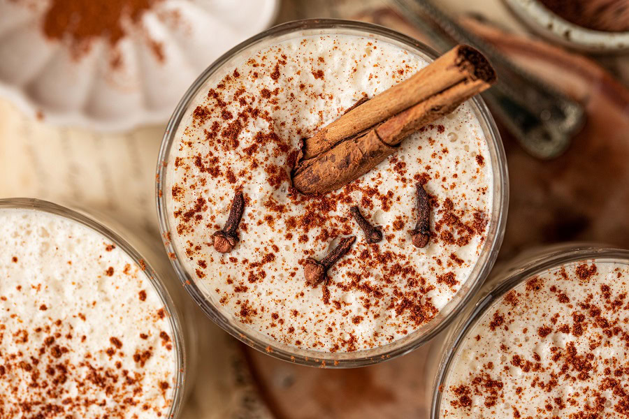 Bourbon Eggnog Recipe Close Up of a Group of Glasses Filled with Eggnog