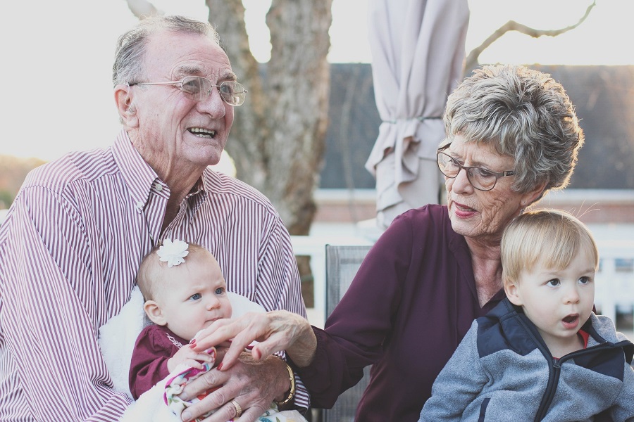 Family Reunion Quotes Two Grandparents Sitting with Their Grand Babies
