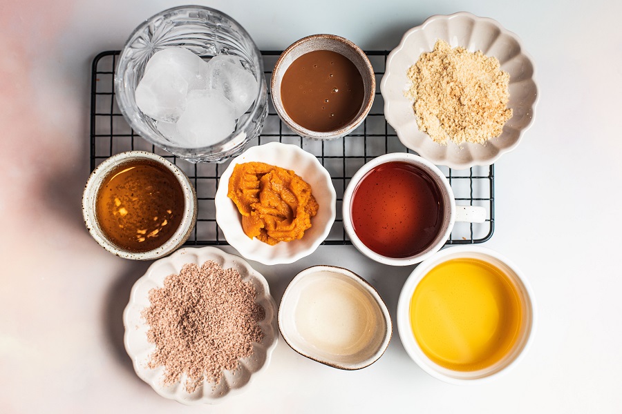 Pumpkin Spice Mocktail Ingredients Laid Out on a Counter Top