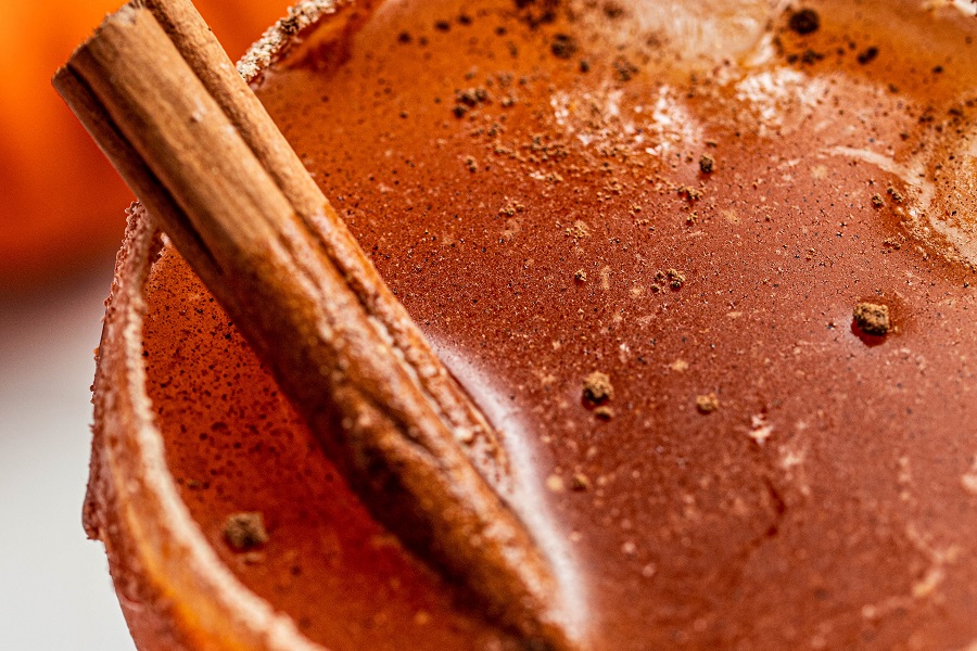 Pumpkin Spice Mocktail Close Up of a Cinnamon Stick in the Mocktail