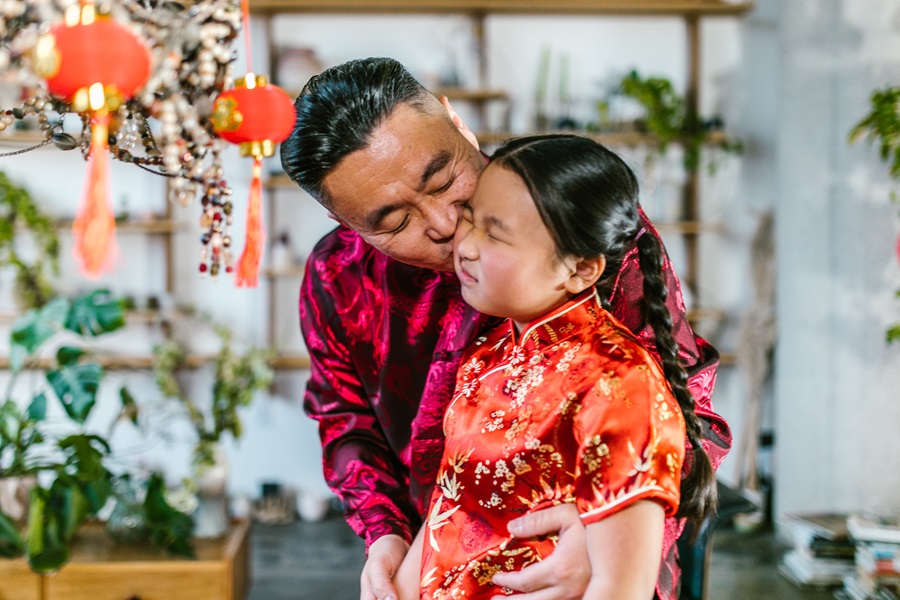 Chinese New Year Food and Recipes a Father Giving His Daughter a Kiss on the Cheek