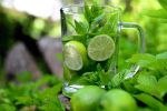 Detox Water Recipes for Weight Loss Close Up of a Glass of Water Filled with Lime Slices and Sprigs of Herbs