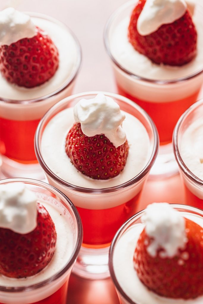 Easy Santa Hat Jello Shot Recipe Close Up of a Bunch of Santa Hat Jello Shots