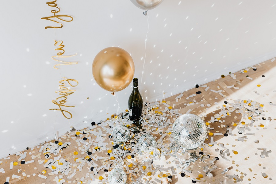 Funny New Year Quotes A Champagne Bottle Sitting on the Floor Surrounded by New Year's Eve Party Decorations