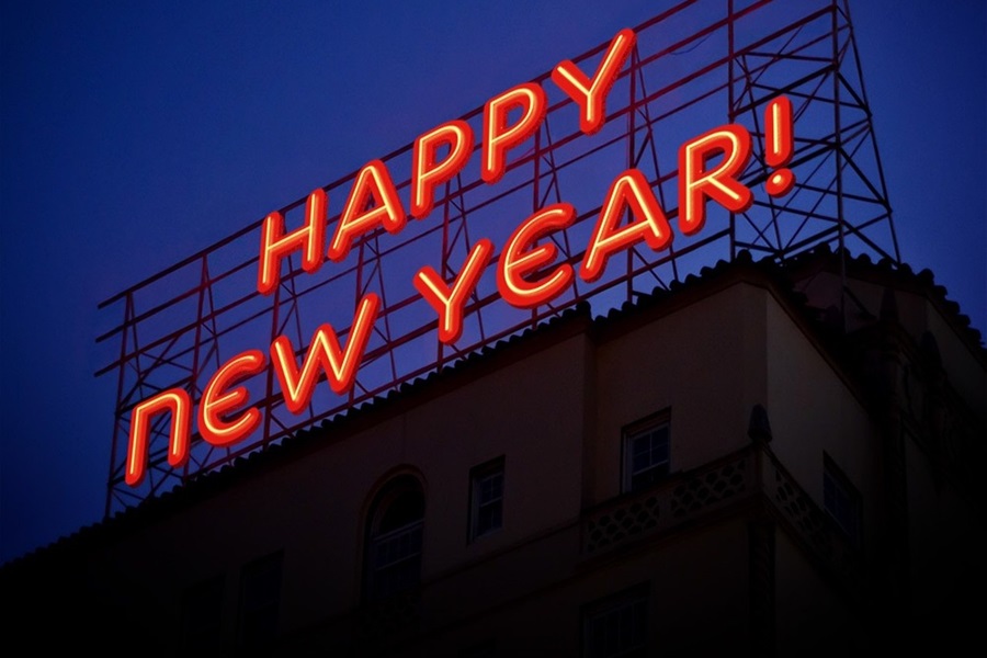Funny New Year Quotes a Lit Up Happy New Year Sign Outside