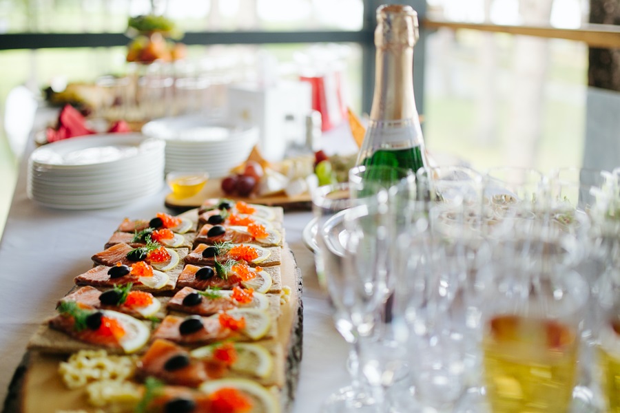 New Years Eve Finger Food Ideas a Table Prepped for a Party with Appetizers, Champagne and Cocktail Glasses