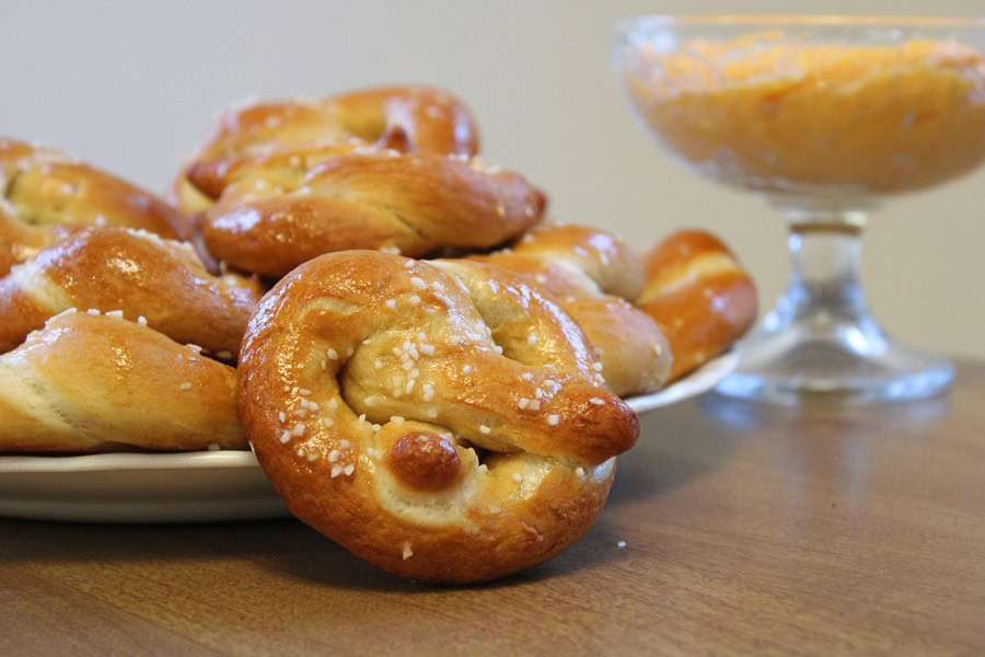 Beer Dip for Pretzels a Small Plate of Pretzels Next to a Glass of Cheese Dip