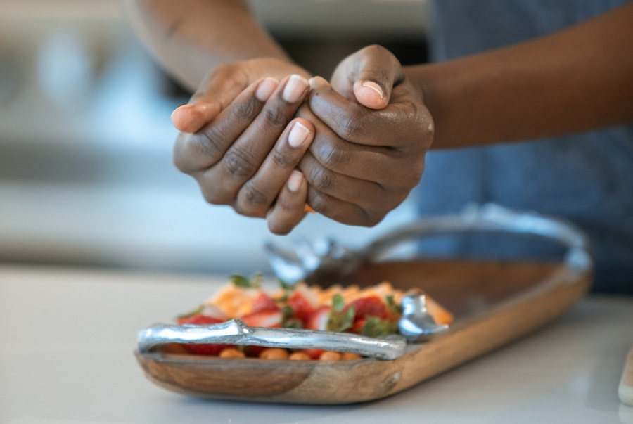 Game Day Charcuterie Board Ideas Close Up of a Person Putting a Charcuterie Board Together From Start