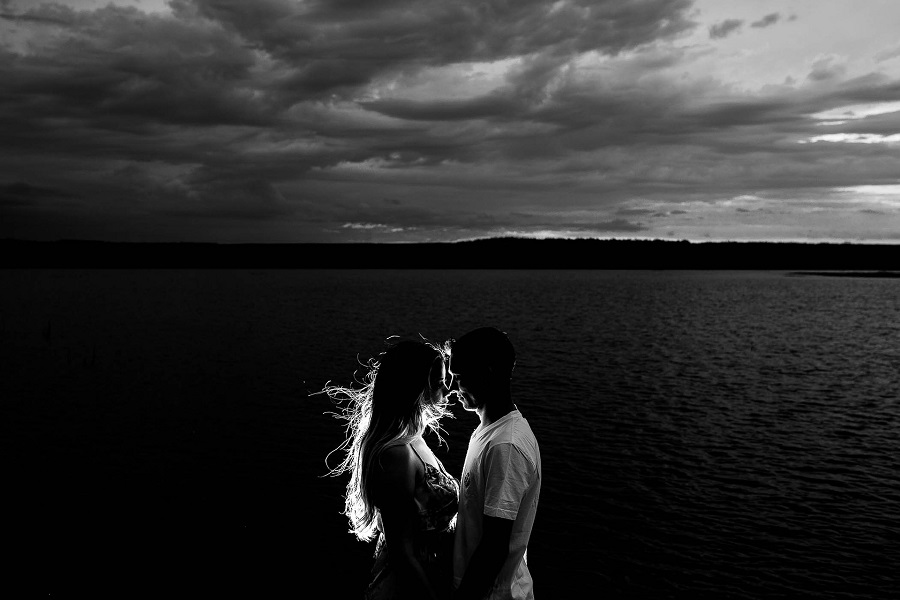 Valentines Photoshoot Ideas Black and White Photo of a Couple Embracing on a Beach