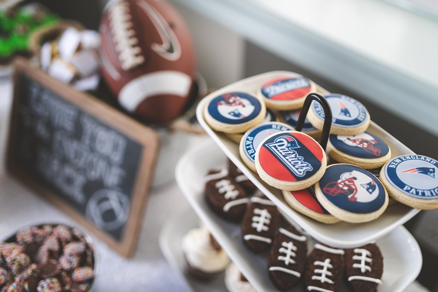 Super Bowl Party Decorations View of a Party Dessert Table with a Football and Football Shaped Cookies 