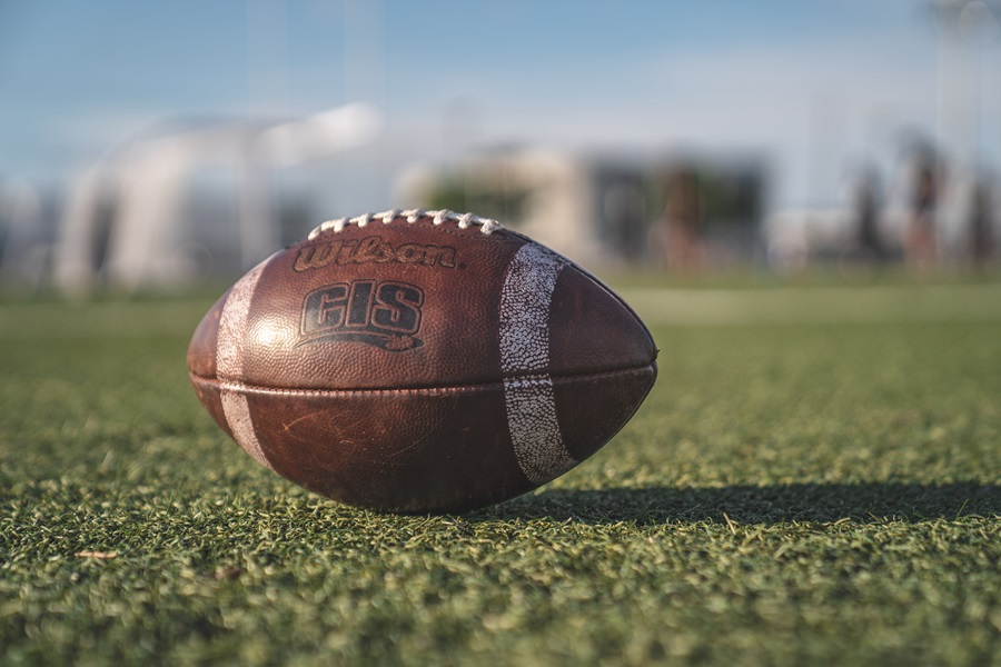 Super Bowl Puns and Quotes Close Up of a Football on a Field