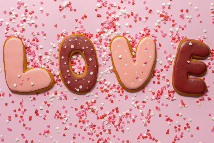 Valentines Cookies Cookies Spelling Out 'Love' with Sprinkles All Over Them